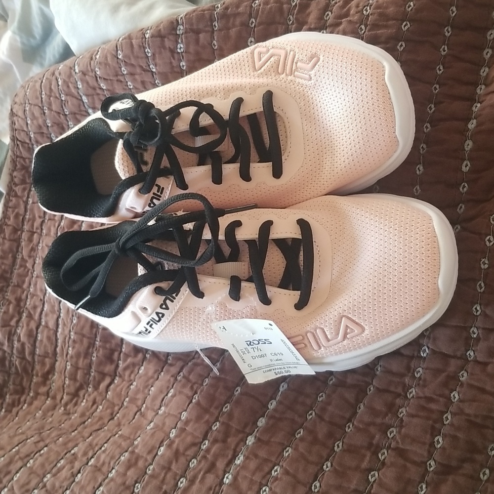 Pink and black Fila tennis shoes